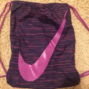 Purple nike cinch bag.